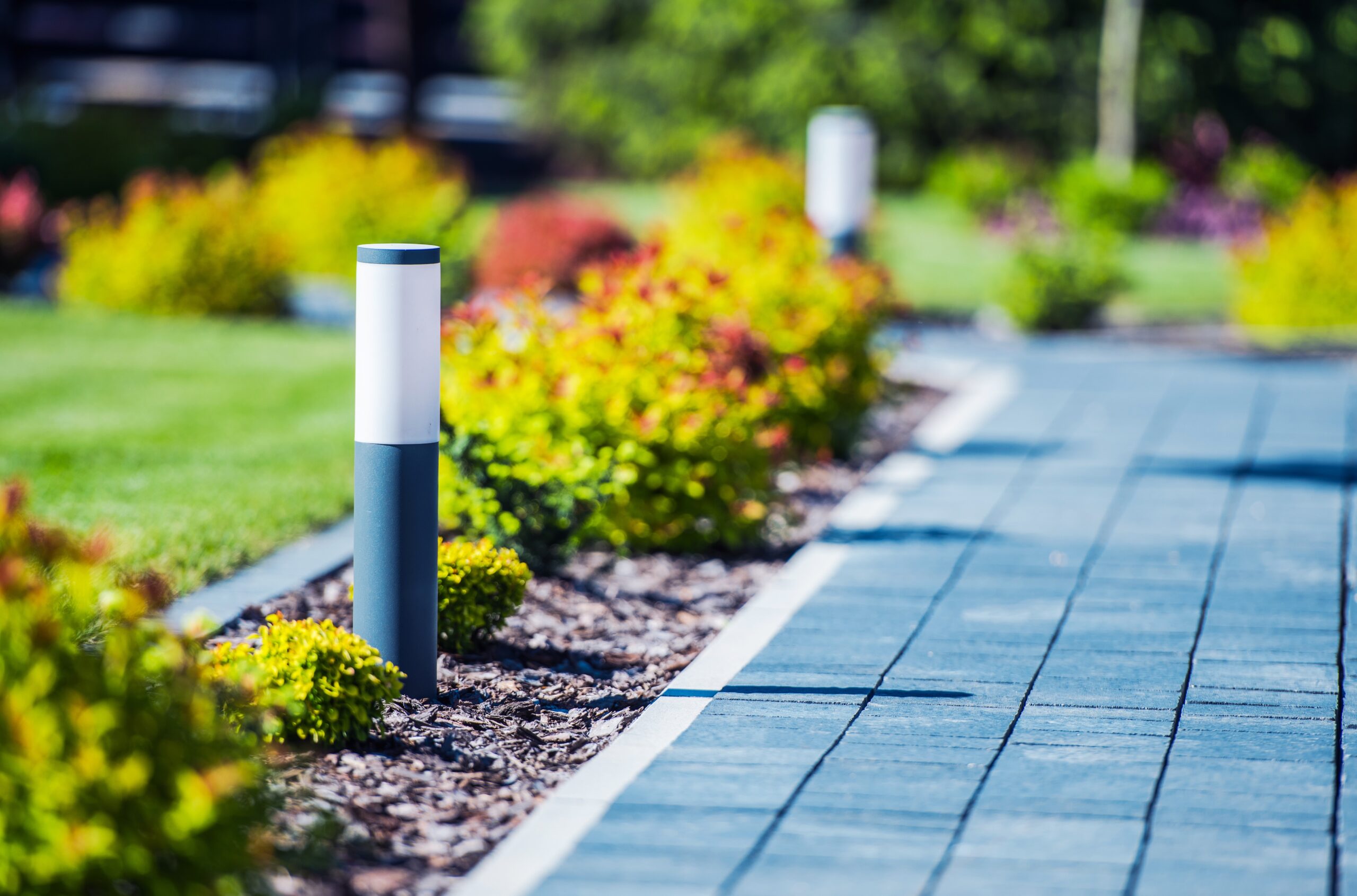 Cobblestone Brick Path in the Garden with Elegant and Modern LED Lighting.